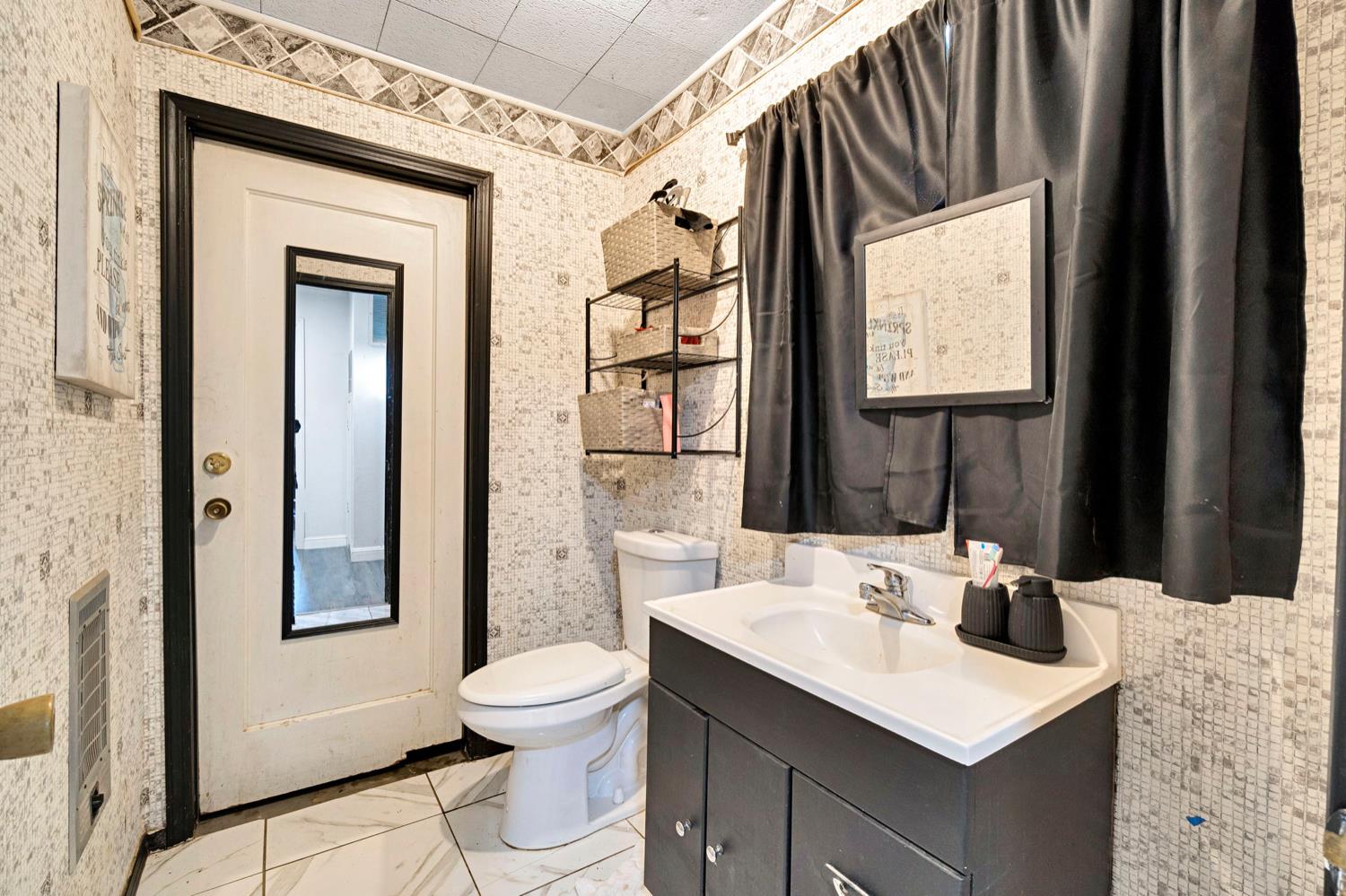 17810 Road 26 Madera, CA 93638 - Photo 27 of 39 a bathroom with a sink vanity mirror and toilet