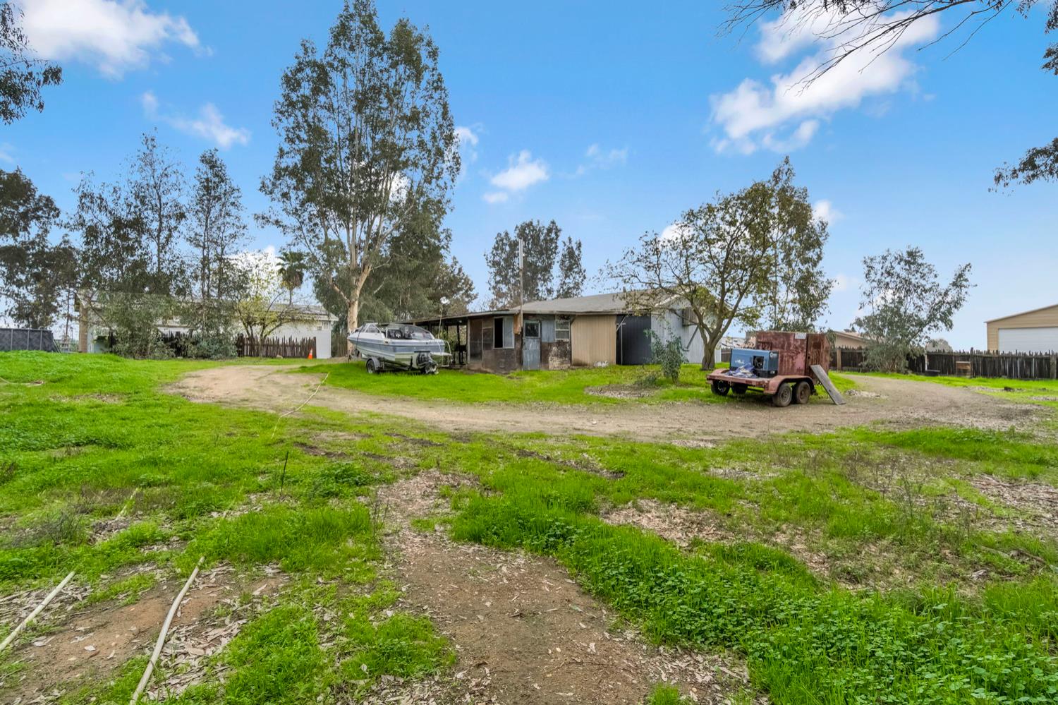 17810 Road 26 Madera, CA 93638 - Photo 36 of 39 a view of a house with a big yard and large trees