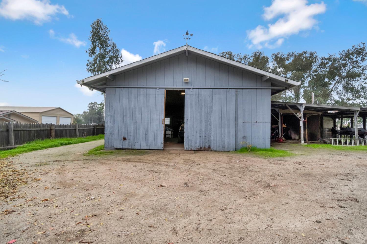 17810 Road 26 Madera, CA 93638 - Photo 37 of 39 a house with a yard in front of it