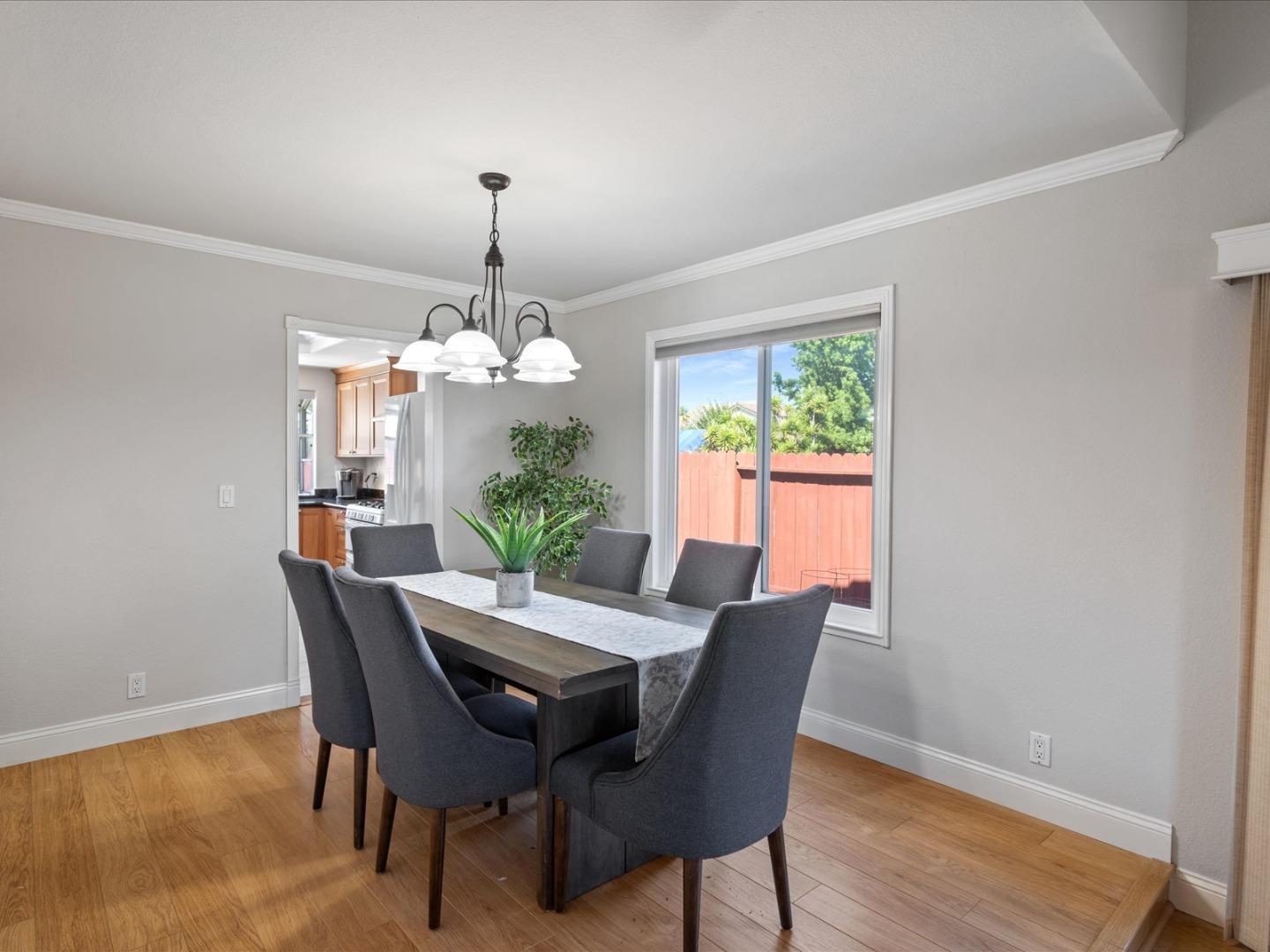 821 Pinehurst Place San Ramon, CA 94583 - Photo 11 of 26 a dining room with furniture potted plants and wooden floor