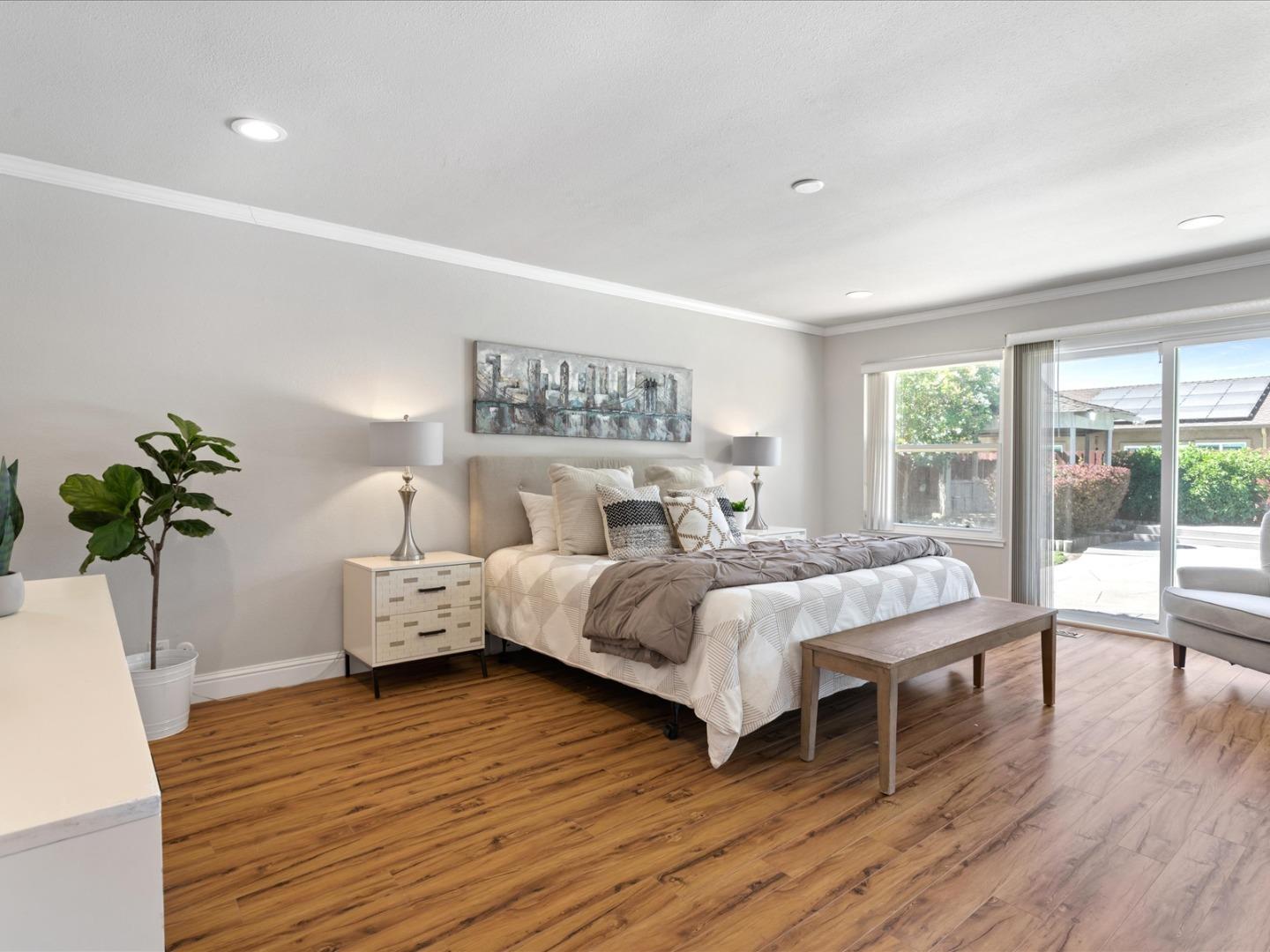 821 Pinehurst Place San Ramon, CA 94583 - Photo 17 of 26 a bedroom with a bed and wooden floor