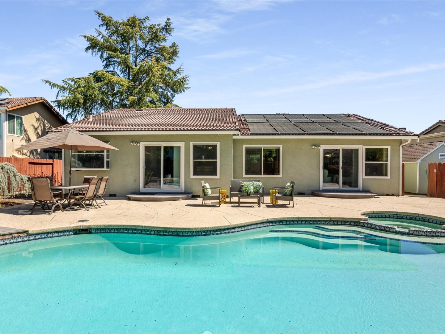 821 Pinehurst Place San Ramon, CA 94583 - Photo 23 of 26 a front view of a house with swimming pool having outdoor seating