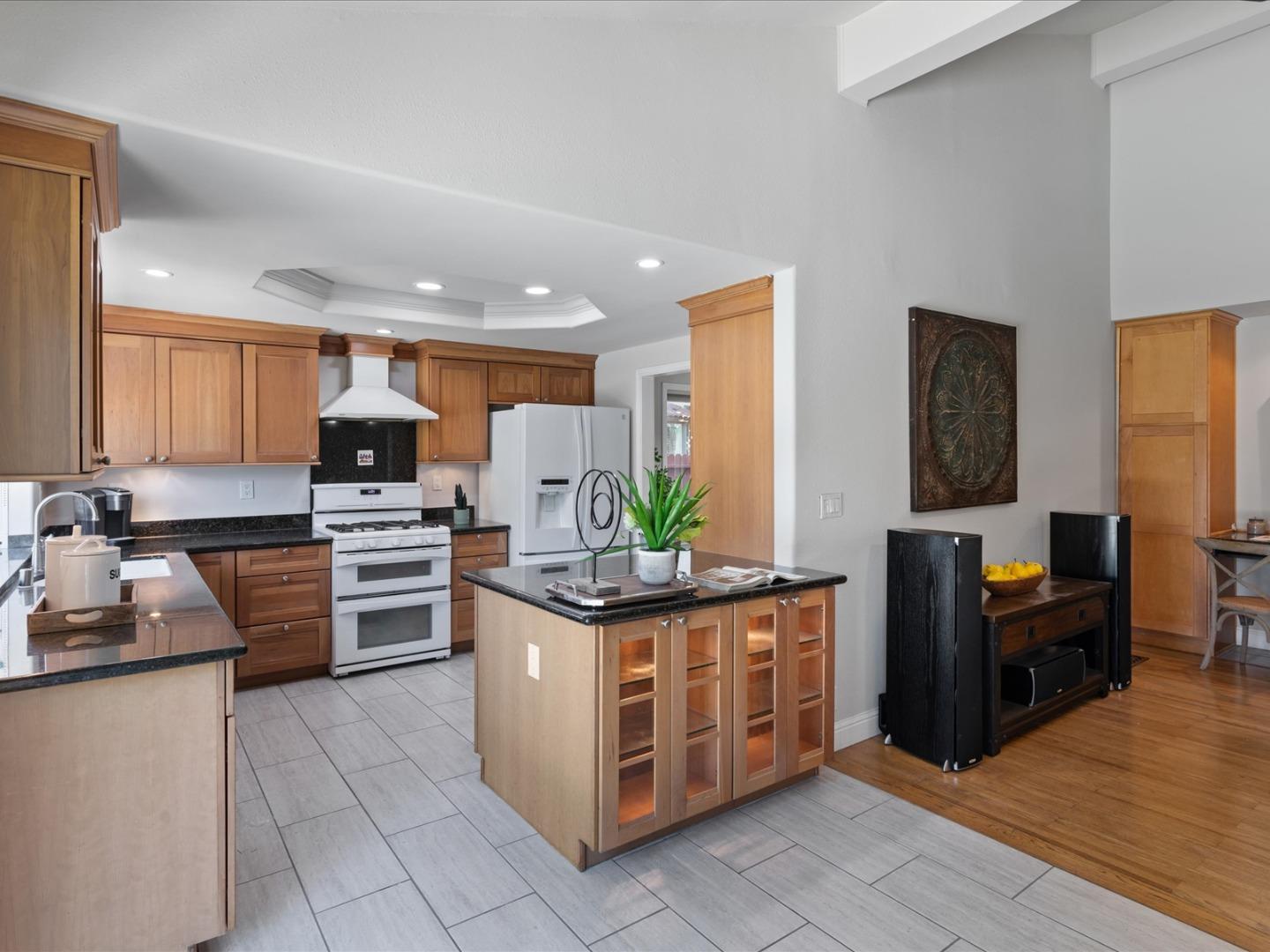 821 Pinehurst Place San Ramon, CA 94583 - Photo 8 of 26 a kitchen with stainless steel appliances granite countertop a stove top oven a sink dishwasher and a refrigerator