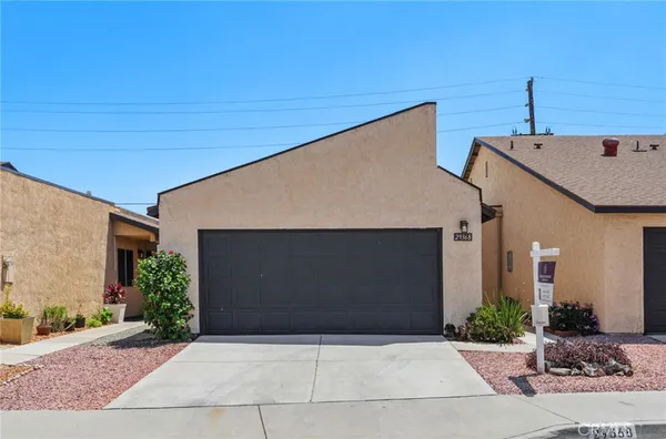 a front view of a house with garage