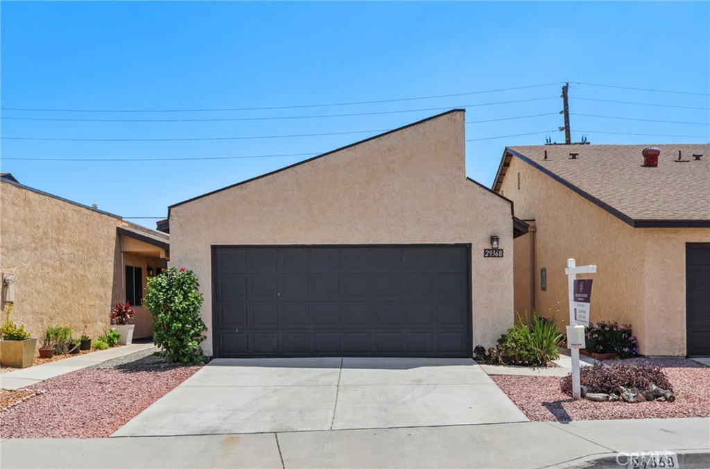 a front view of a house with garage