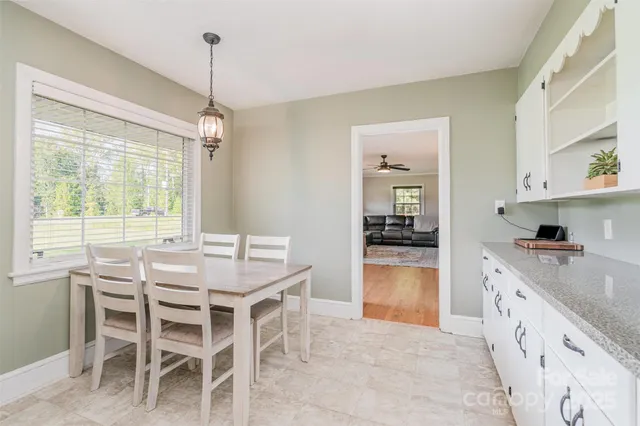 a kitchen with granite countertop furniture and a wooden floor