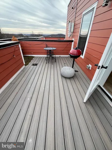 a view of outdoor space with wooden floor