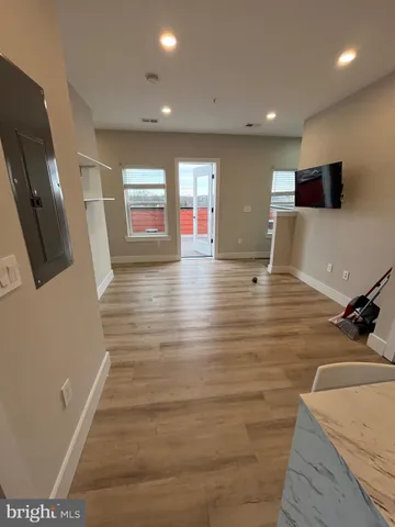 a view of a living room with flat screen tv