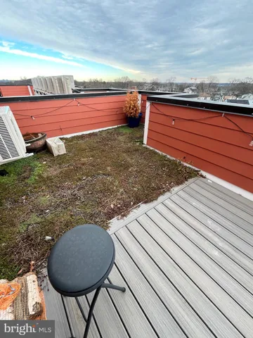 a view of a backyard with wooden floor
