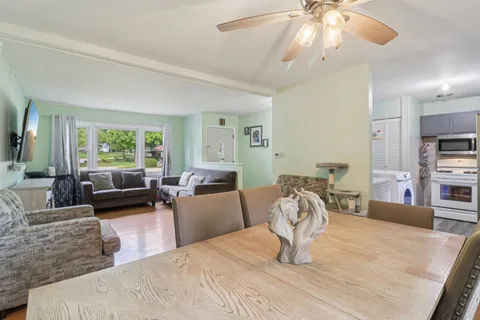 a bedroom with furniture and a large window