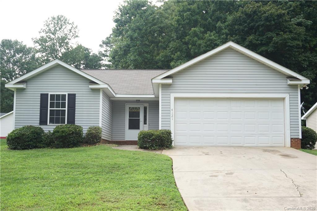 4121 Oakwood Road Charlotte, NC 28269 - Photo 1 of 15 a view of a house with yard and plants