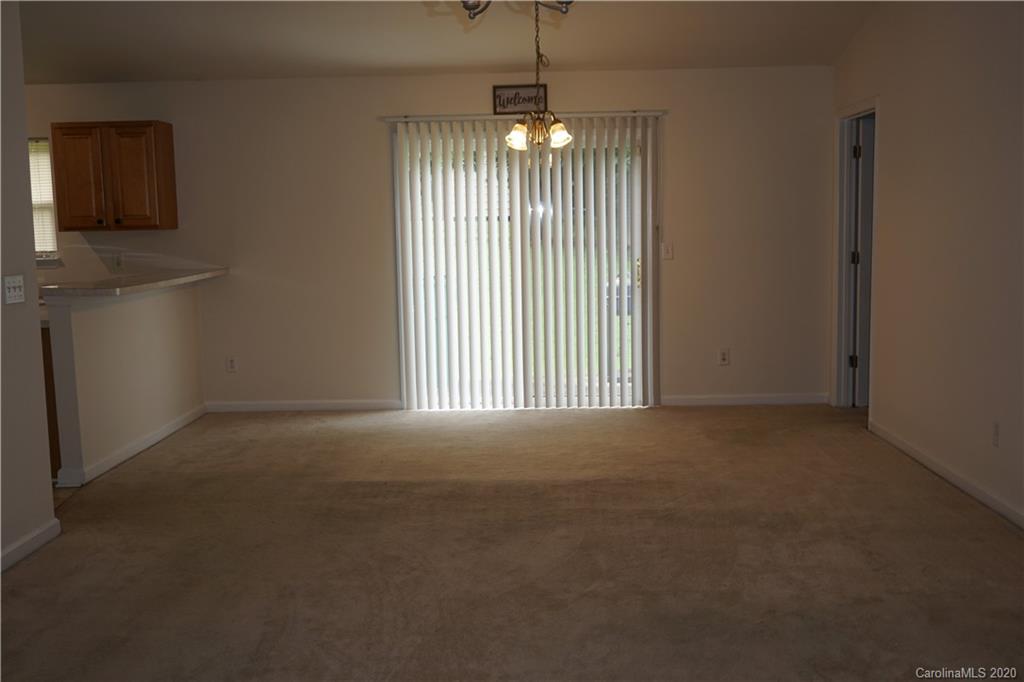 4121 Oakwood Road Charlotte, NC 28269 - Photo 5 of 15 a view of an empty room with a window