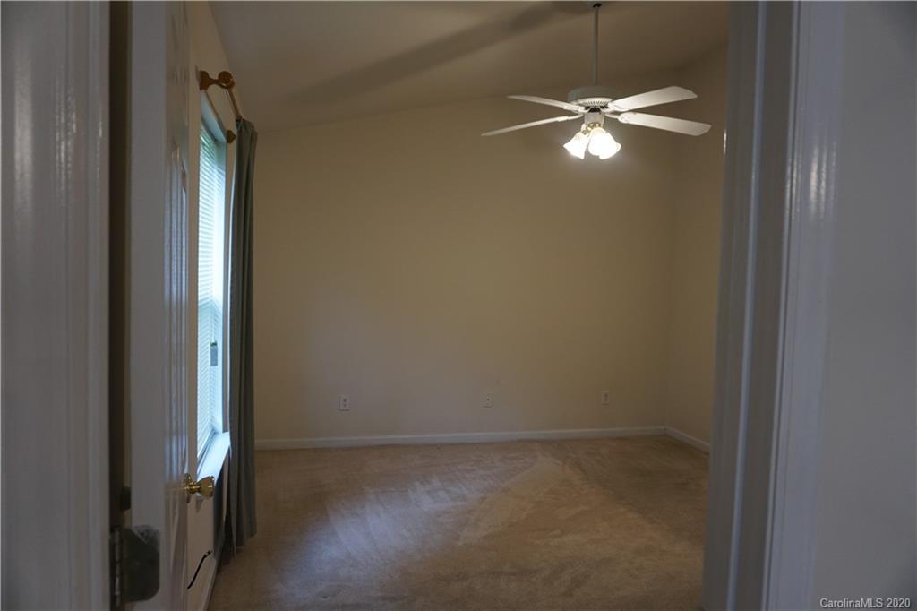 4121 Oakwood Road Charlotte, NC 28269 - Photo 6 of 15 a view of a livingroom with a chandelier fan