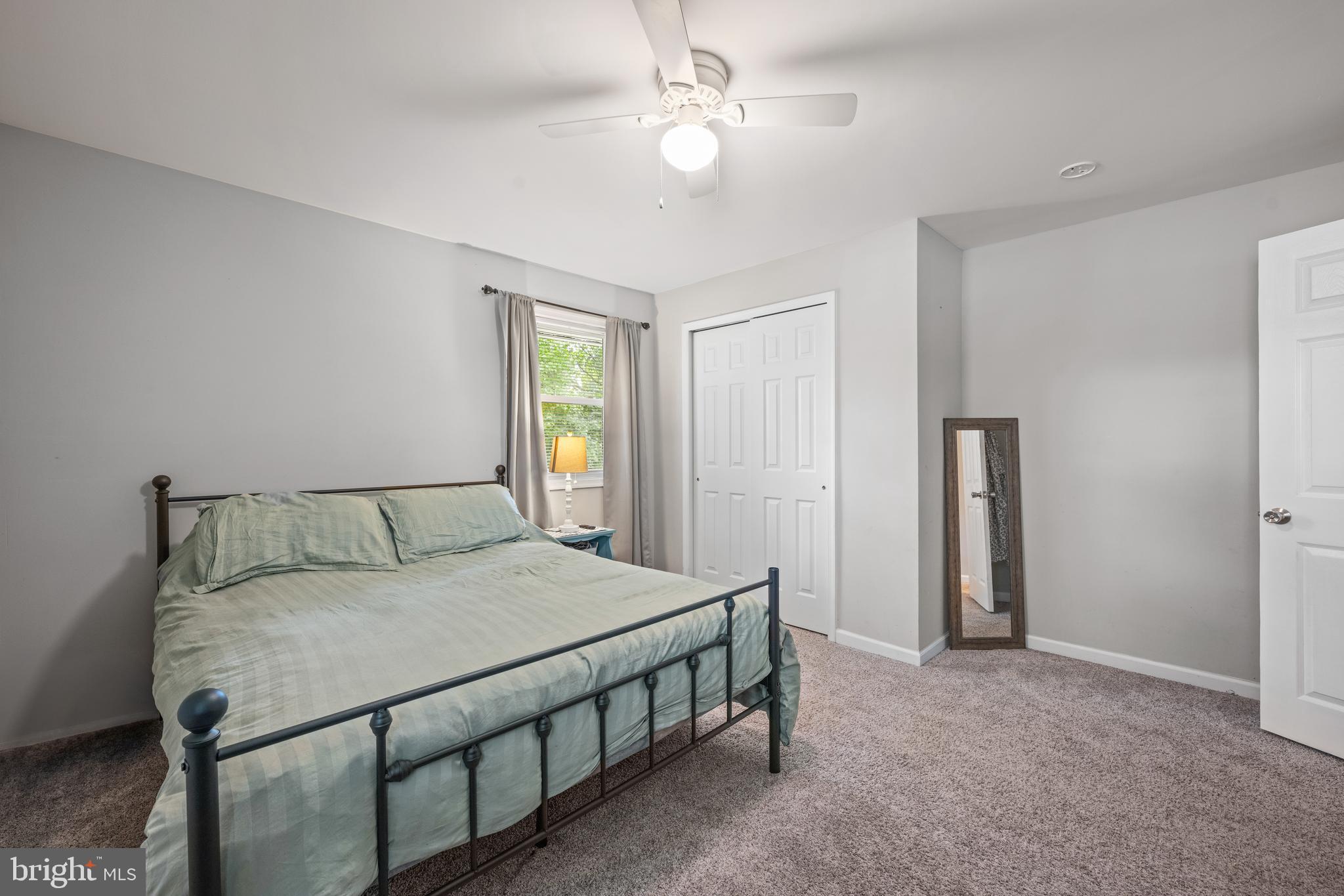 329 Sheffield Road Cherry Hill, NJ 08034 - Photo 15 of 30 a bedroom with a bed a ceiling fan and a dresser