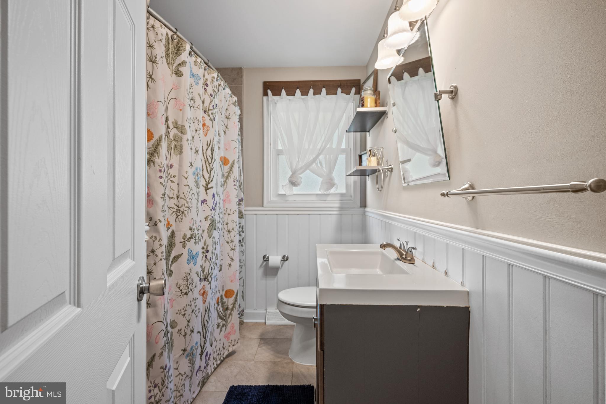 329 Sheffield Road Cherry Hill, NJ 08034 - Photo 16 of 30 a bathroom with a sink and a mirror