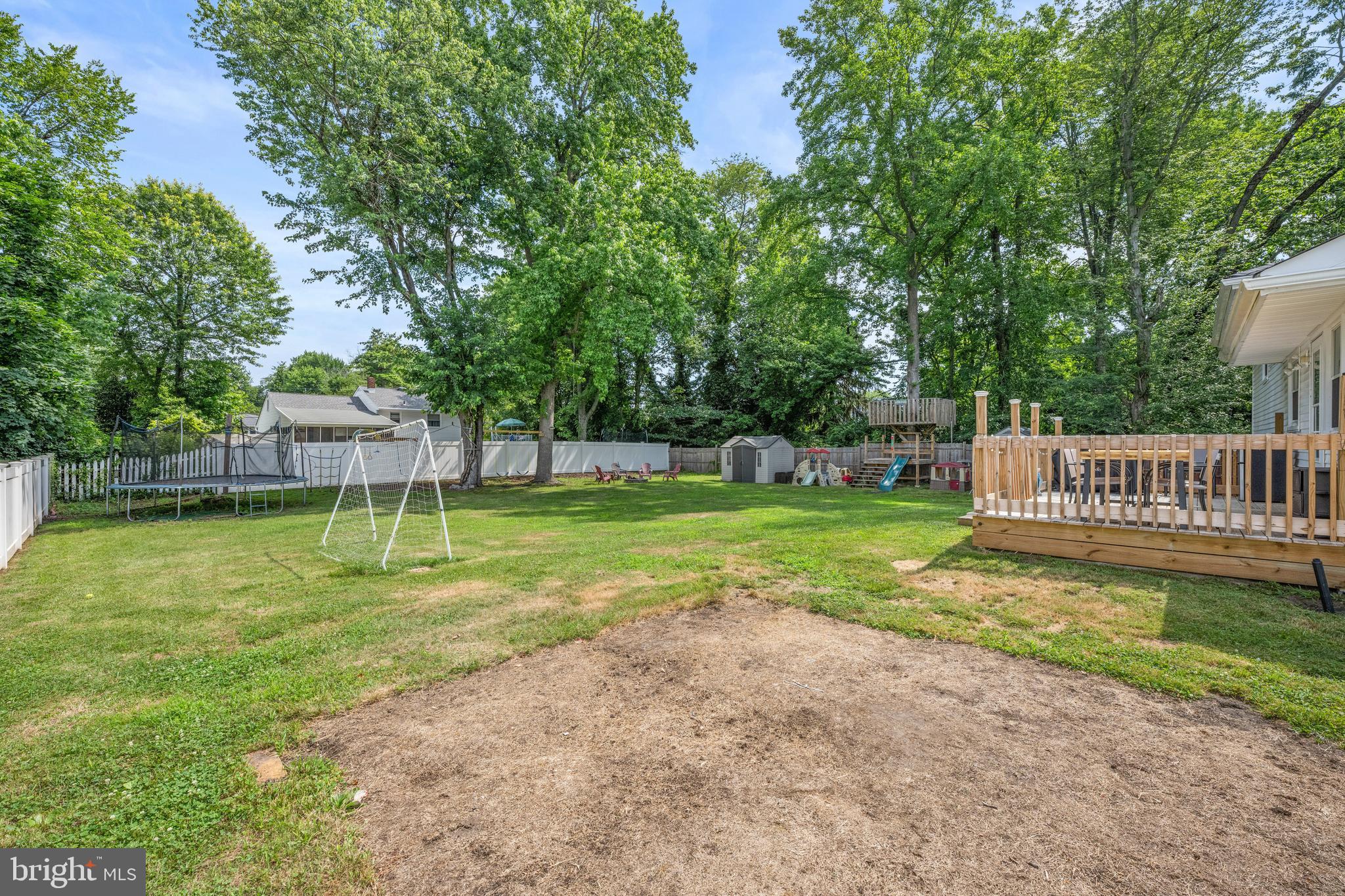 329 Sheffield Road Cherry Hill, NJ 08034 - Photo 23 of 30 a view of a house with a yard and a garden