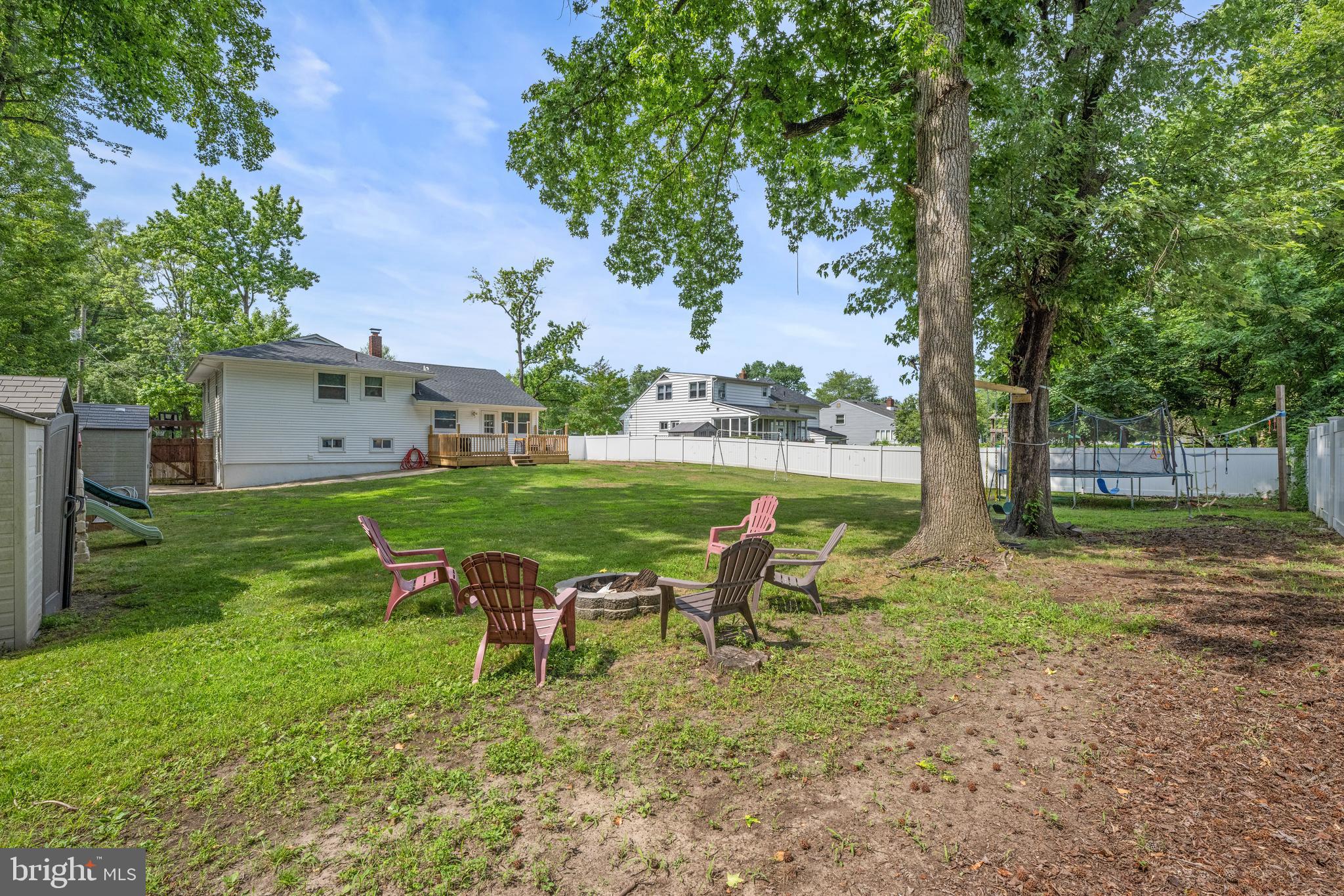 329 Sheffield Road Cherry Hill, NJ 08034 - Photo 26 of 30 a backyard of a house with table and chairs