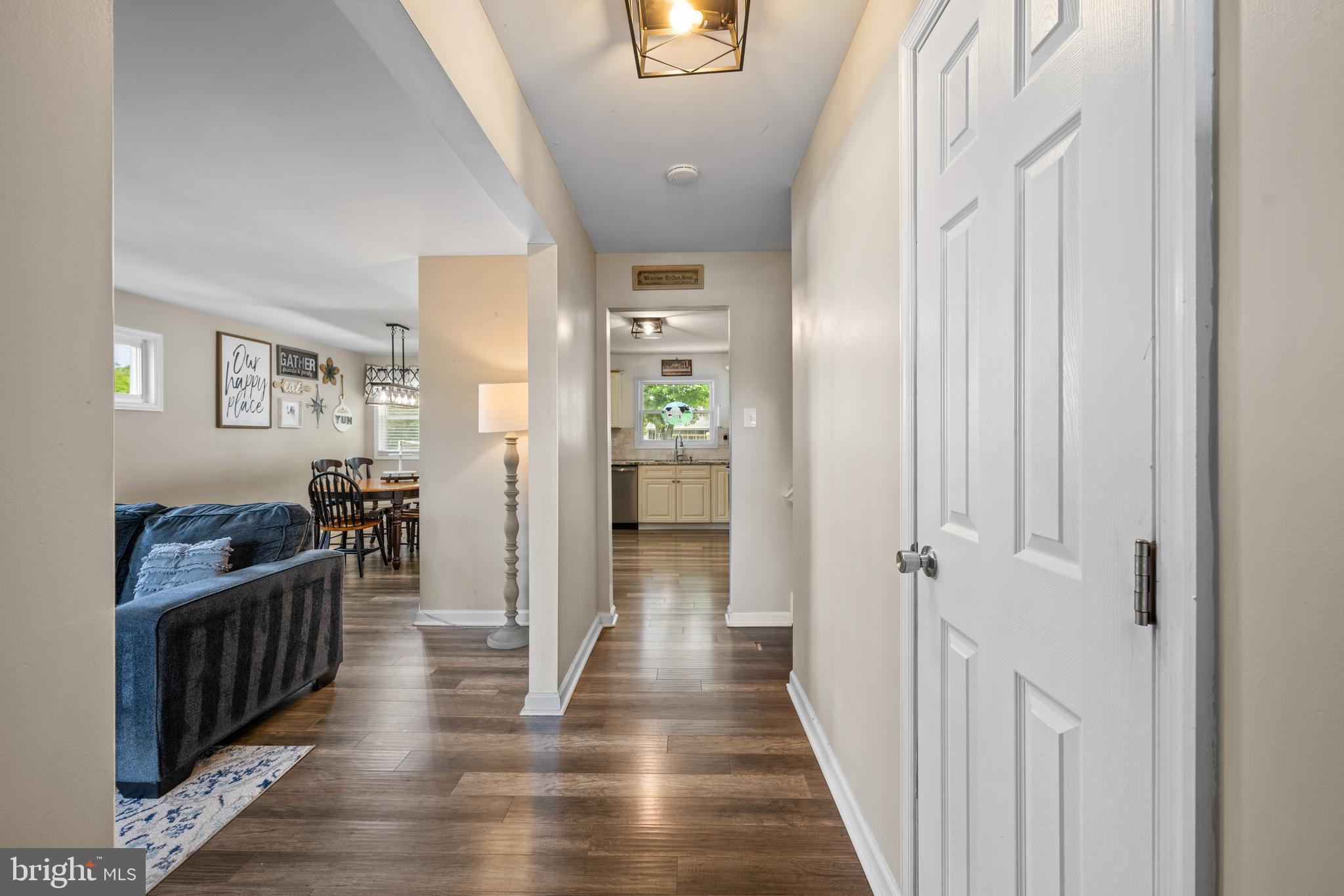 329 Sheffield Road Cherry Hill, NJ 08034 - Photo 4 of 30 a view of a hallway with wooden floor and stairs