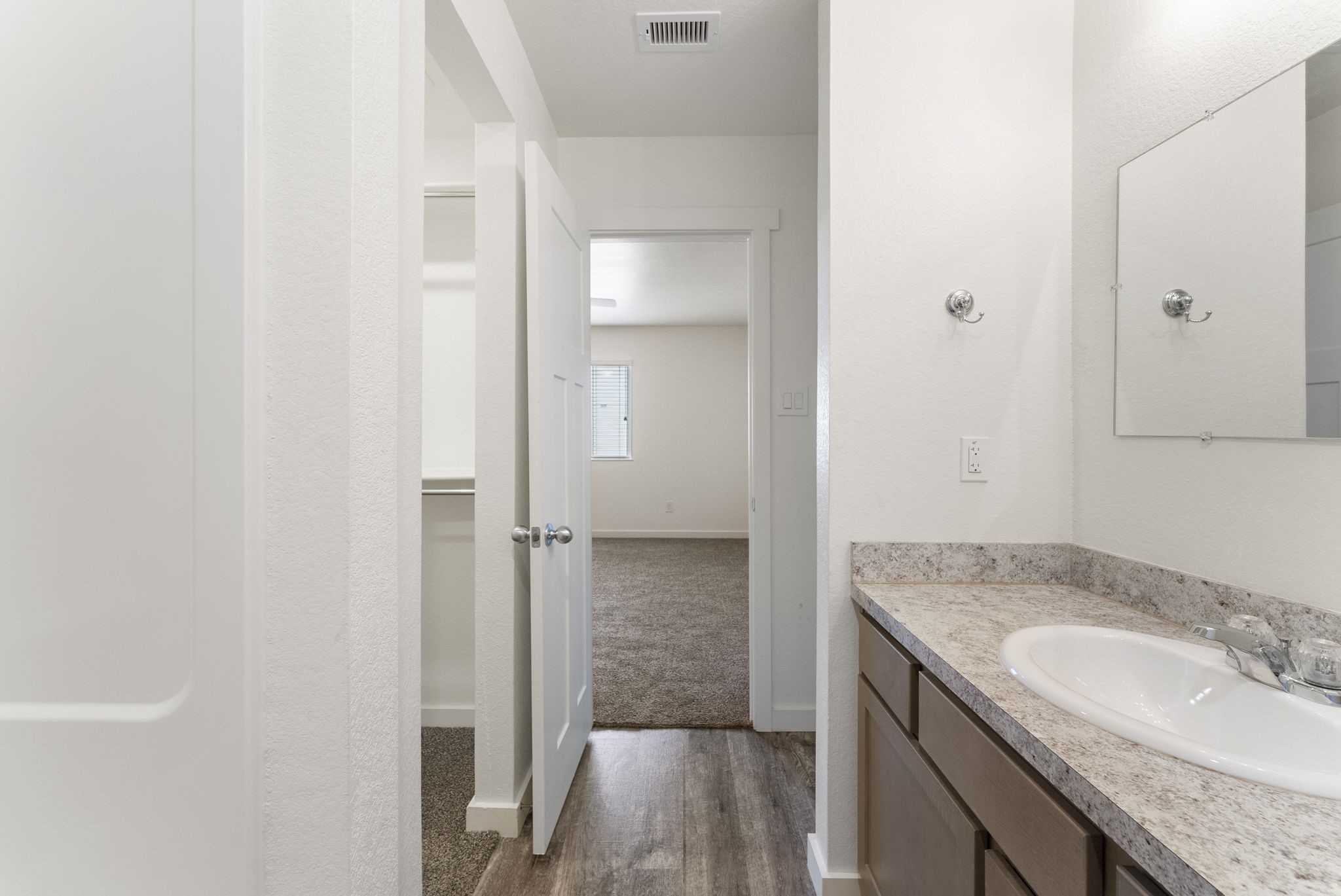 21155 Gosling Road, Unit 22AD Spring, TX 77388 - Photo 13 of 23 a bathroom with a granite countertop sink and a mirror