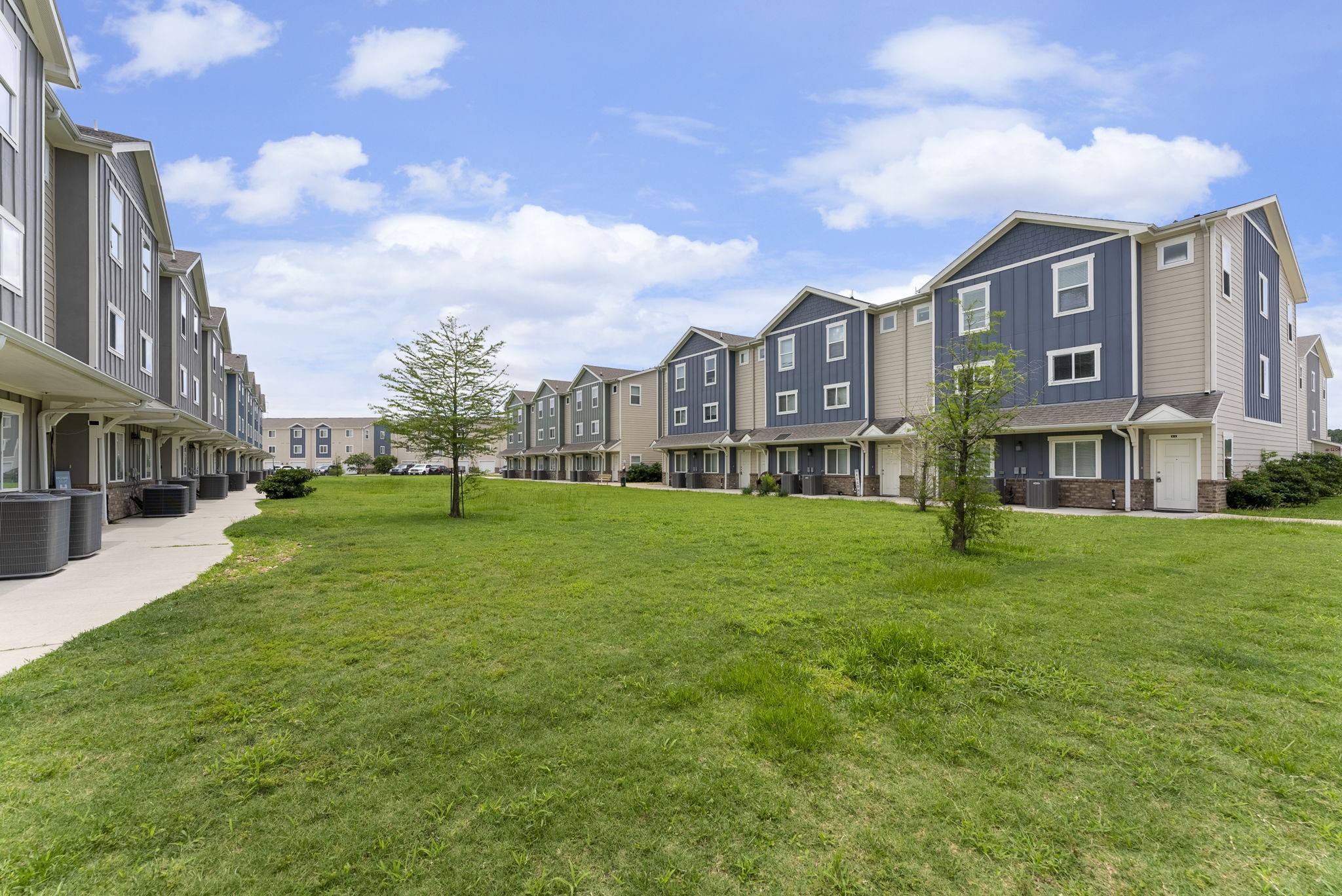 21155 Gosling Road, Unit 22AD Spring, TX 77388 - Photo 23 of 23 a brick building with a yard in front of it