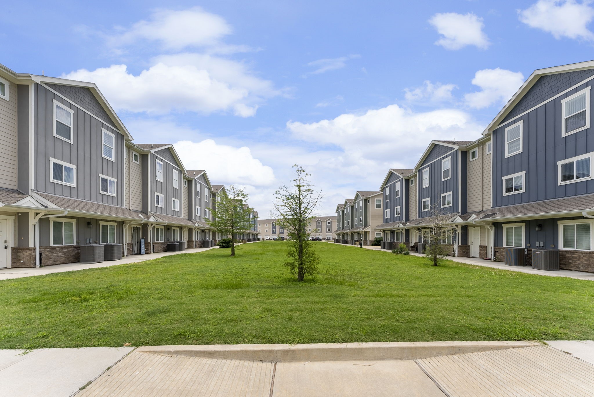 21155 Gosling Road, Unit 22AD Spring, TX 77388 - Photo 3 of 23 a view of a building with a yard