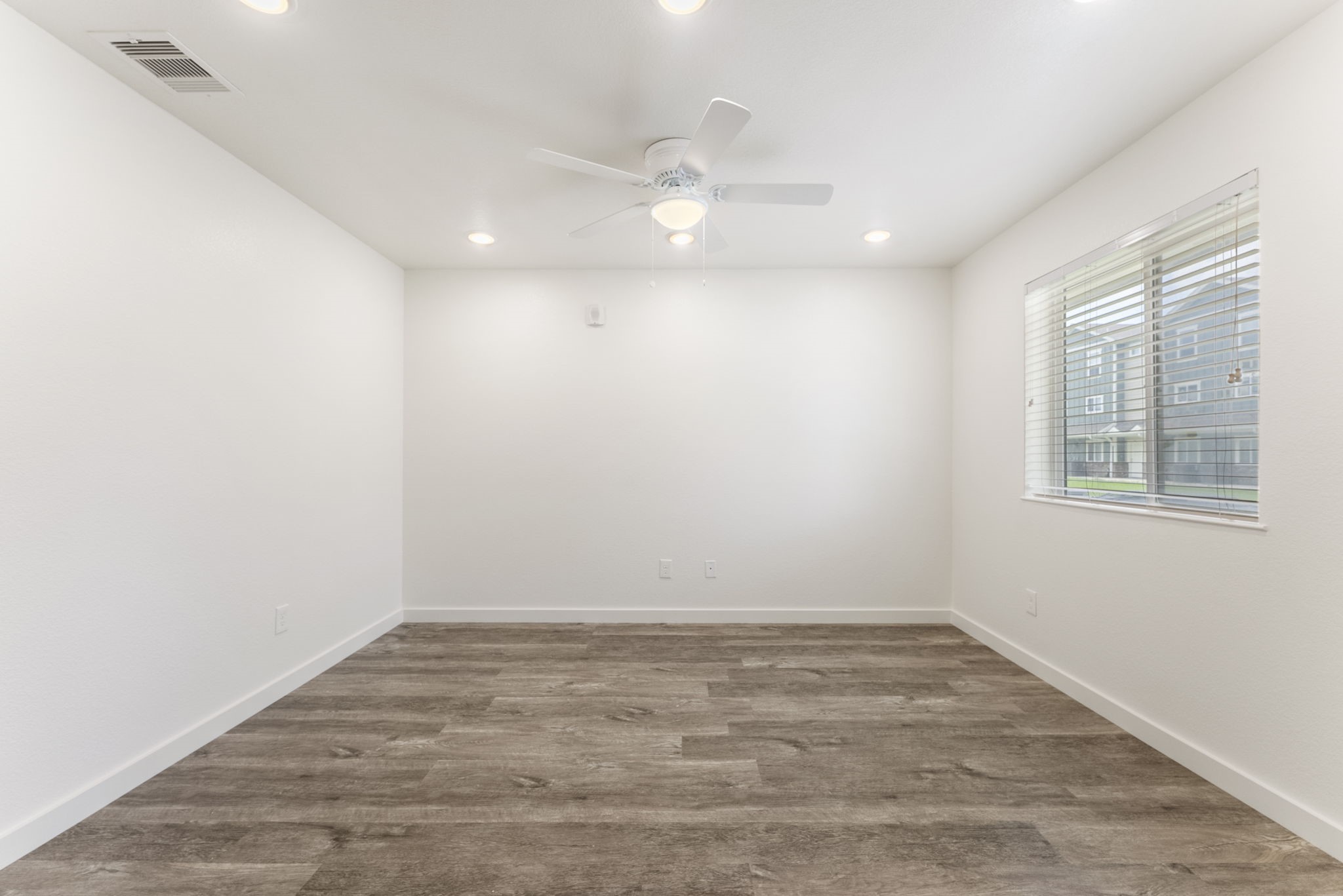 21155 Gosling Road, Unit 22AD Spring, TX 77388 - Photo 6 of 23 wooden floor in an empty room with a window