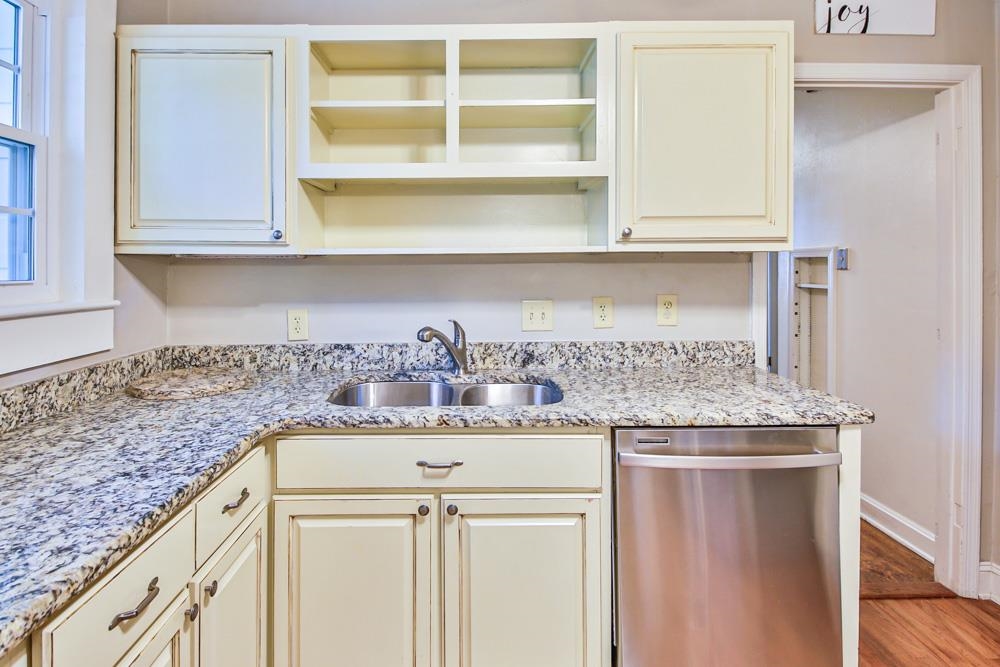 4964 Sequoia Road Memphis, TN 38117 - Photo 9 of 18 a kitchen with granite countertop cabinets stainless steel appliances and a counter space