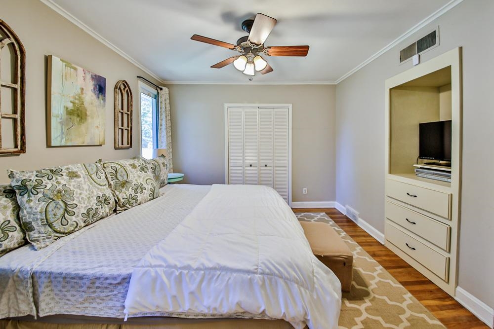 4964 Sequoia Road Memphis, TN 38117 - Photo 10 of 18 a bedroom with a bed and a chandelier