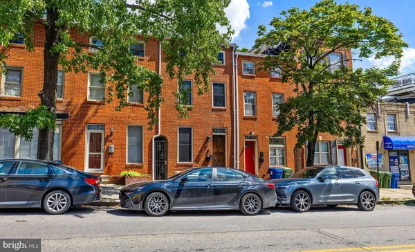 a car parked in front of a house