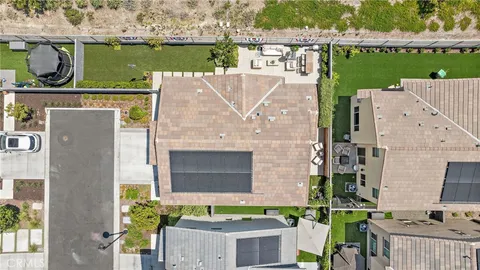 an aerial view of a house with a ocean view
