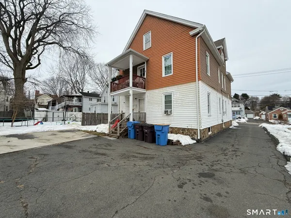 a view of a house with a yard and garage