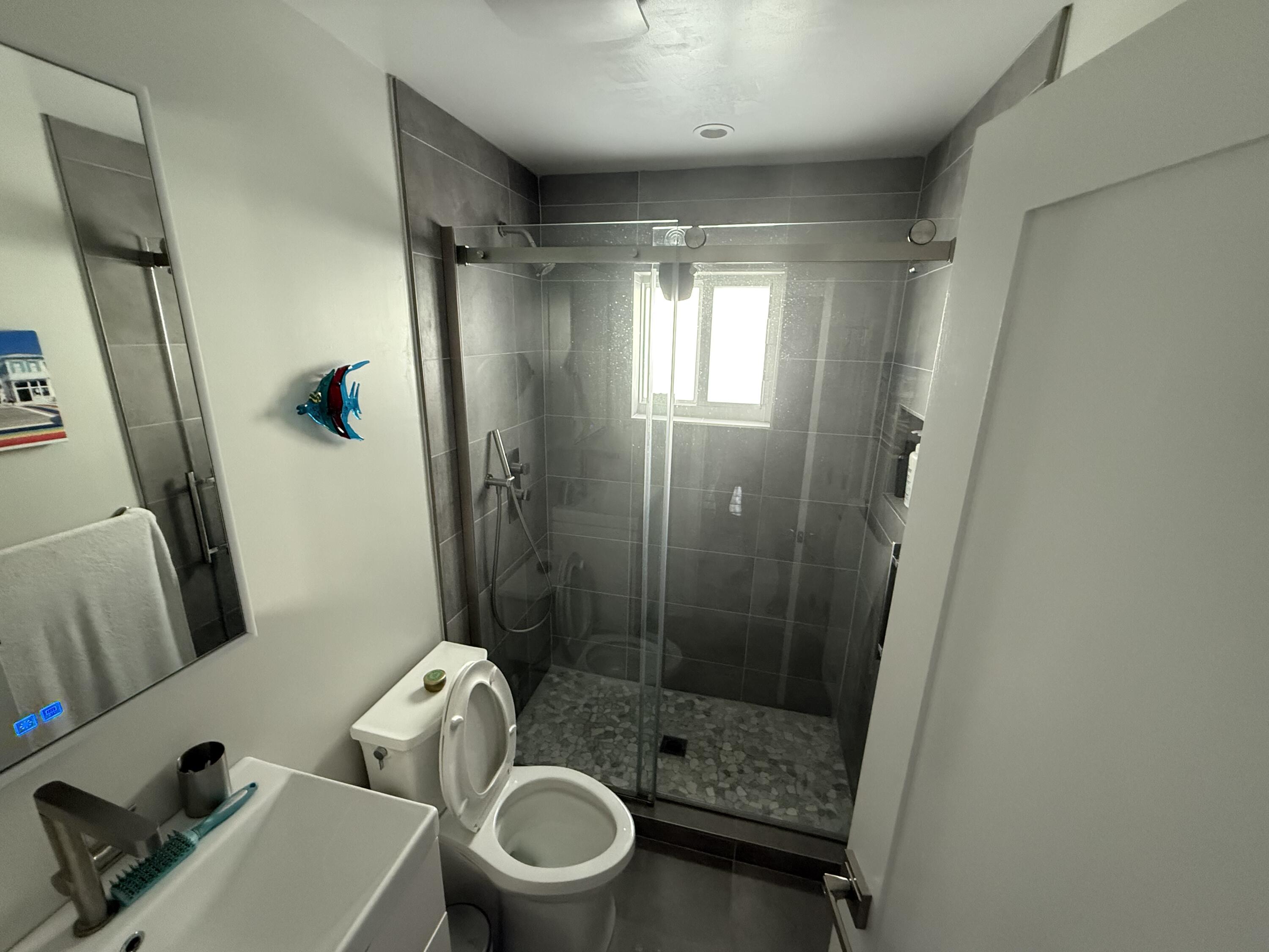 8 North End Road Key Largo, FL 33037 - Photo 11 of 16 a bathroom with a shower and a toilet