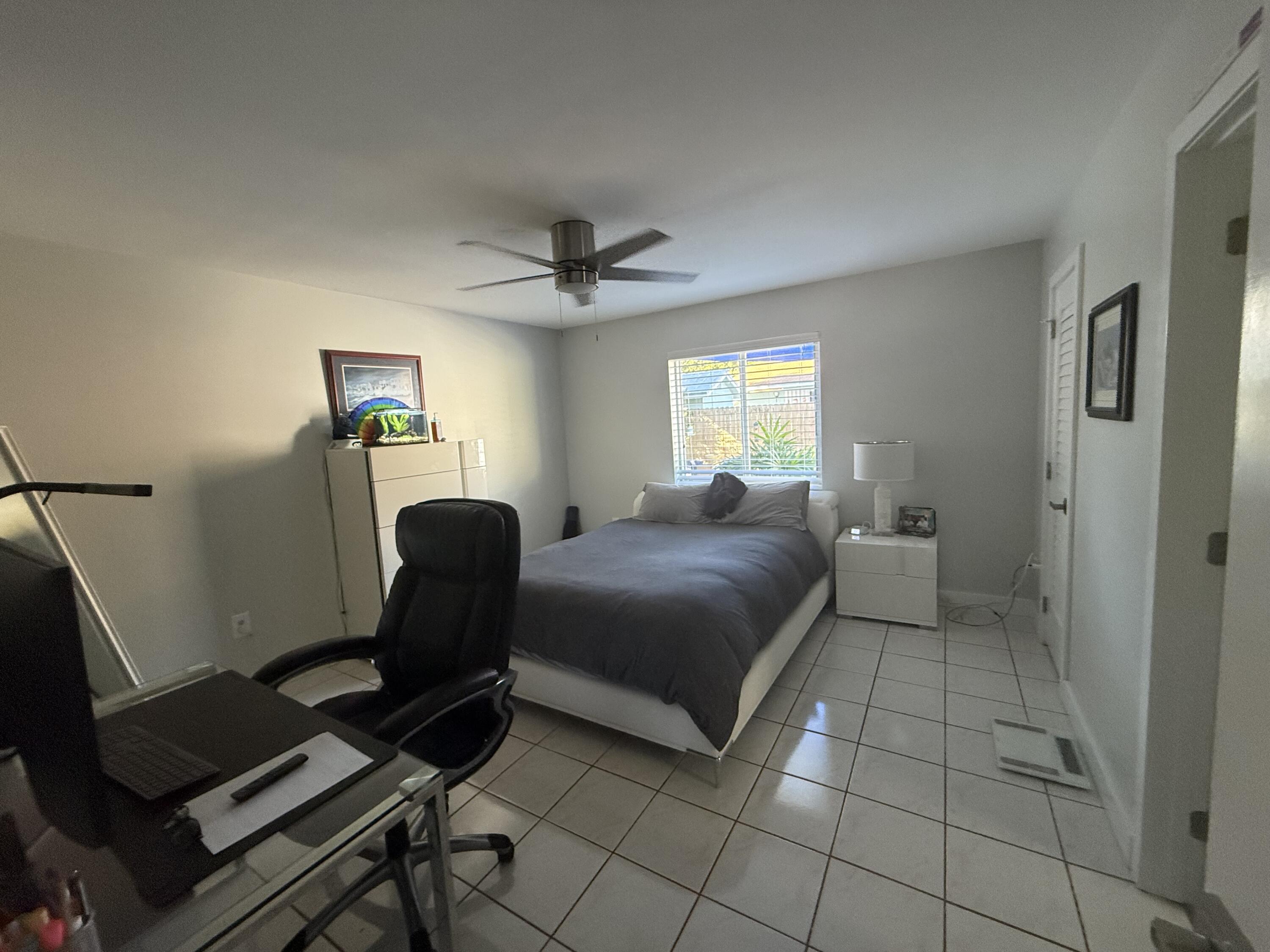 8 North End Road Key Largo, FL 33037 - Photo 12 of 16 a bedroom with a bed and a chair