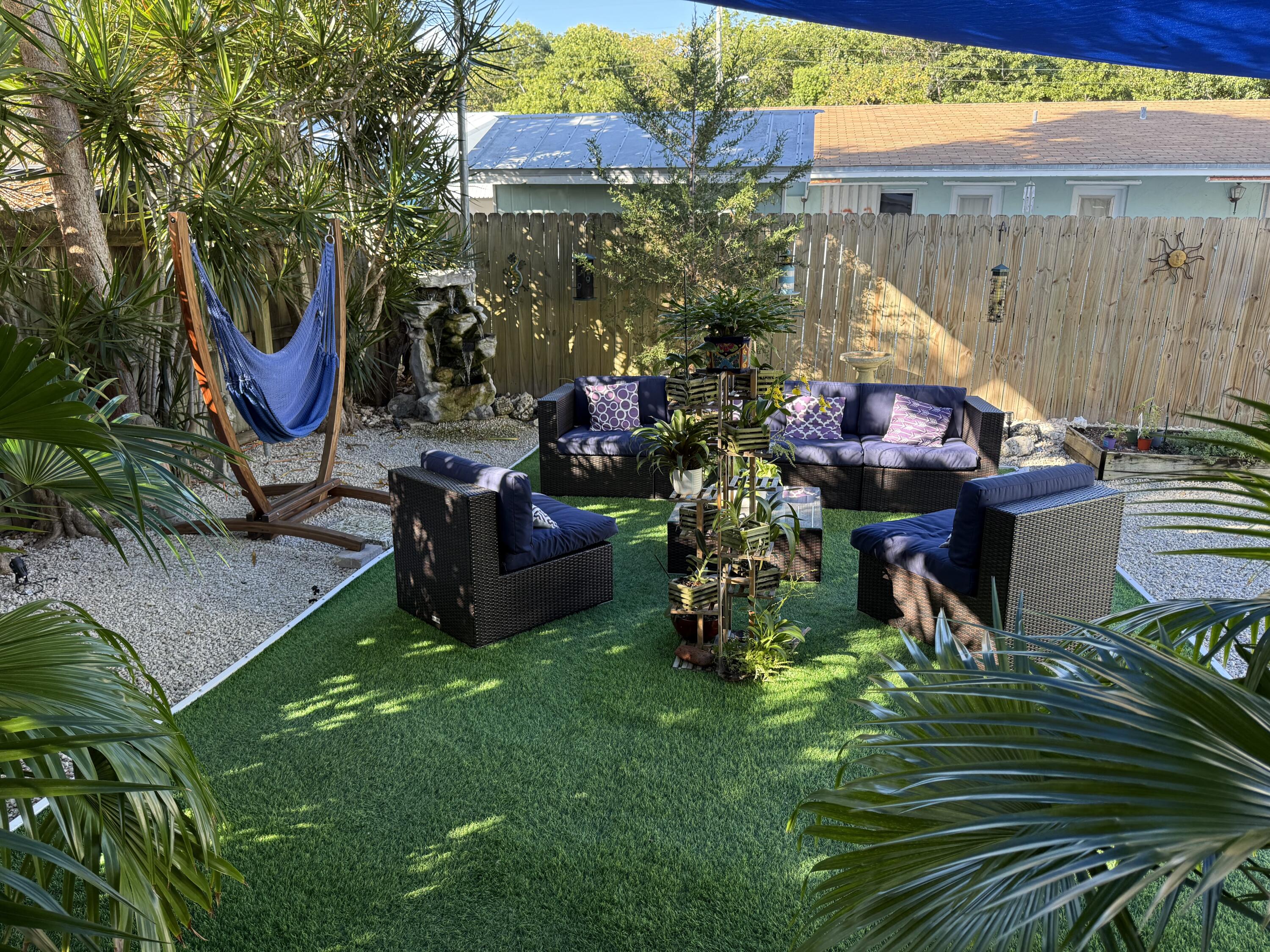 8 North End Road Key Largo, FL 33037 - Photo 13 of 16 a view of outdoor dining space with a patio and a slide