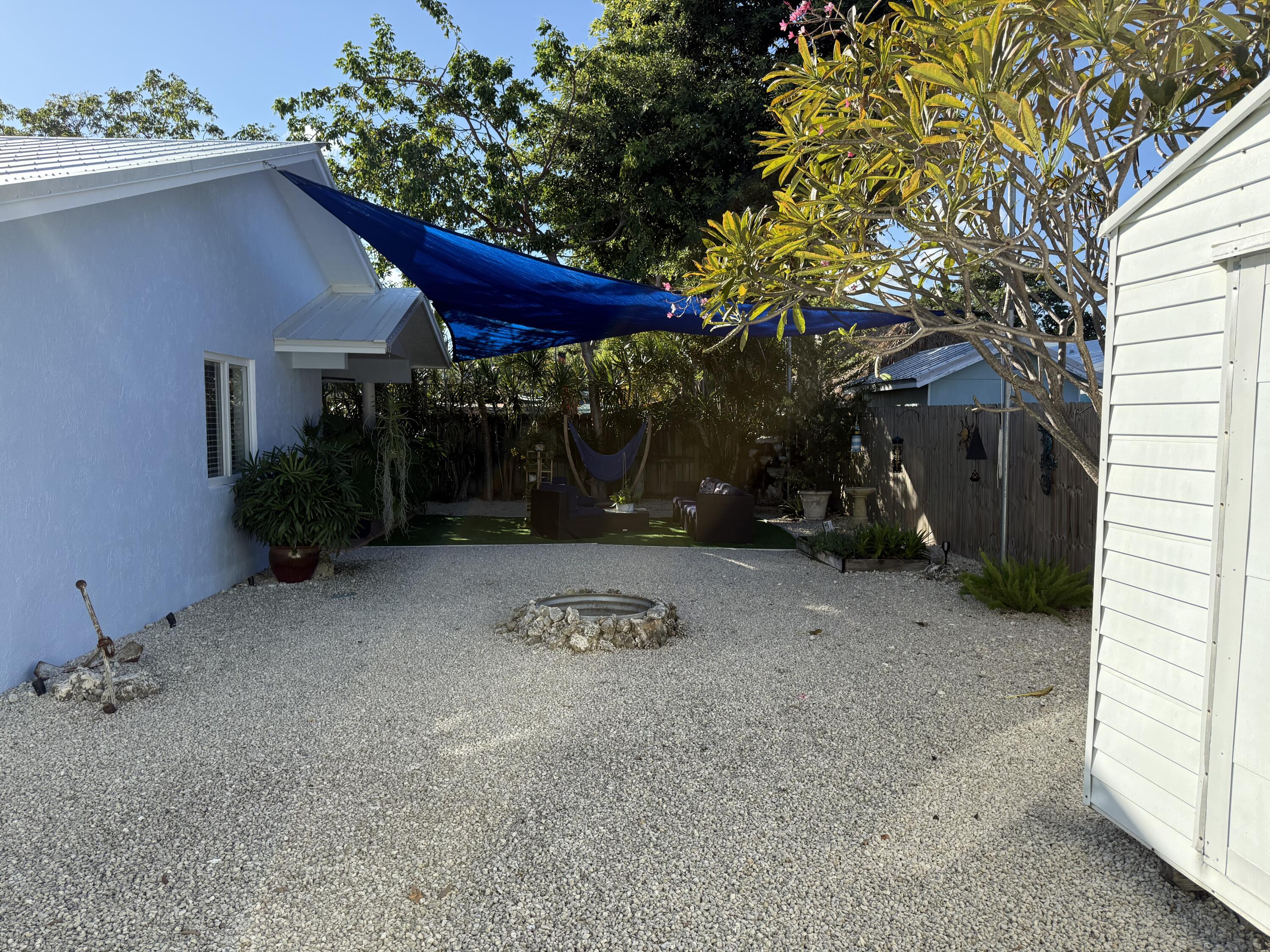 8 North End Road Key Largo, FL 33037 - Photo 15 of 16 a view of a house with a yard