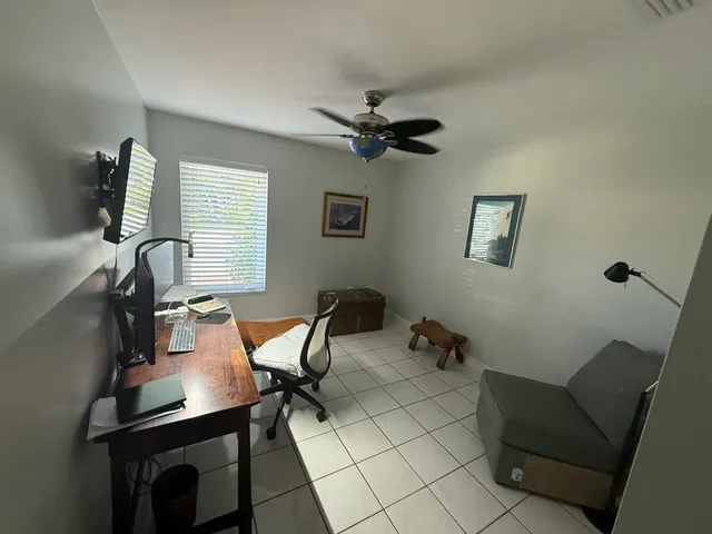 a living room with a bed furniture and a window