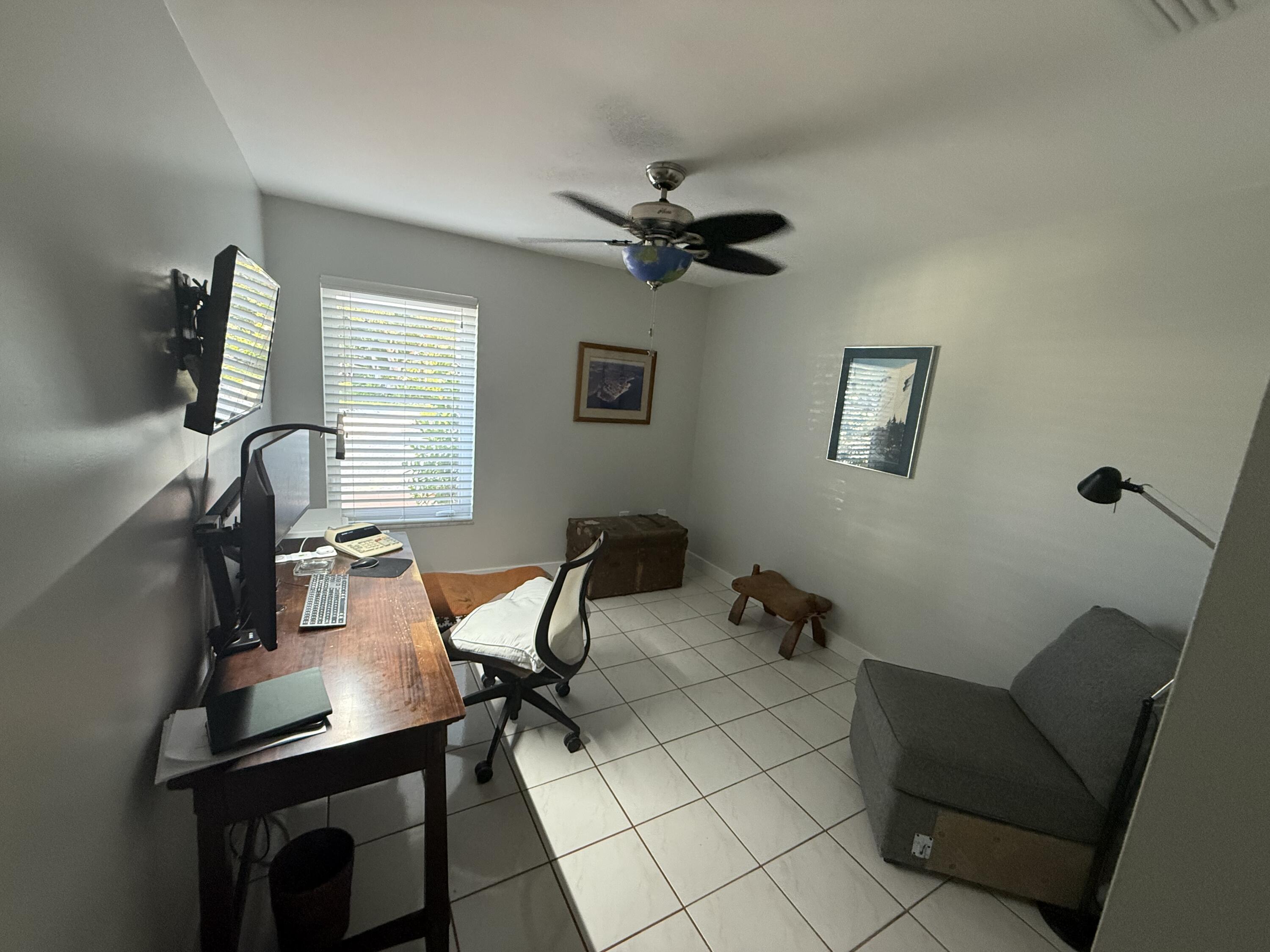 8 North End Road Key Largo, FL 33037 - Photo 8 of 16 a work room with furniture and windows
