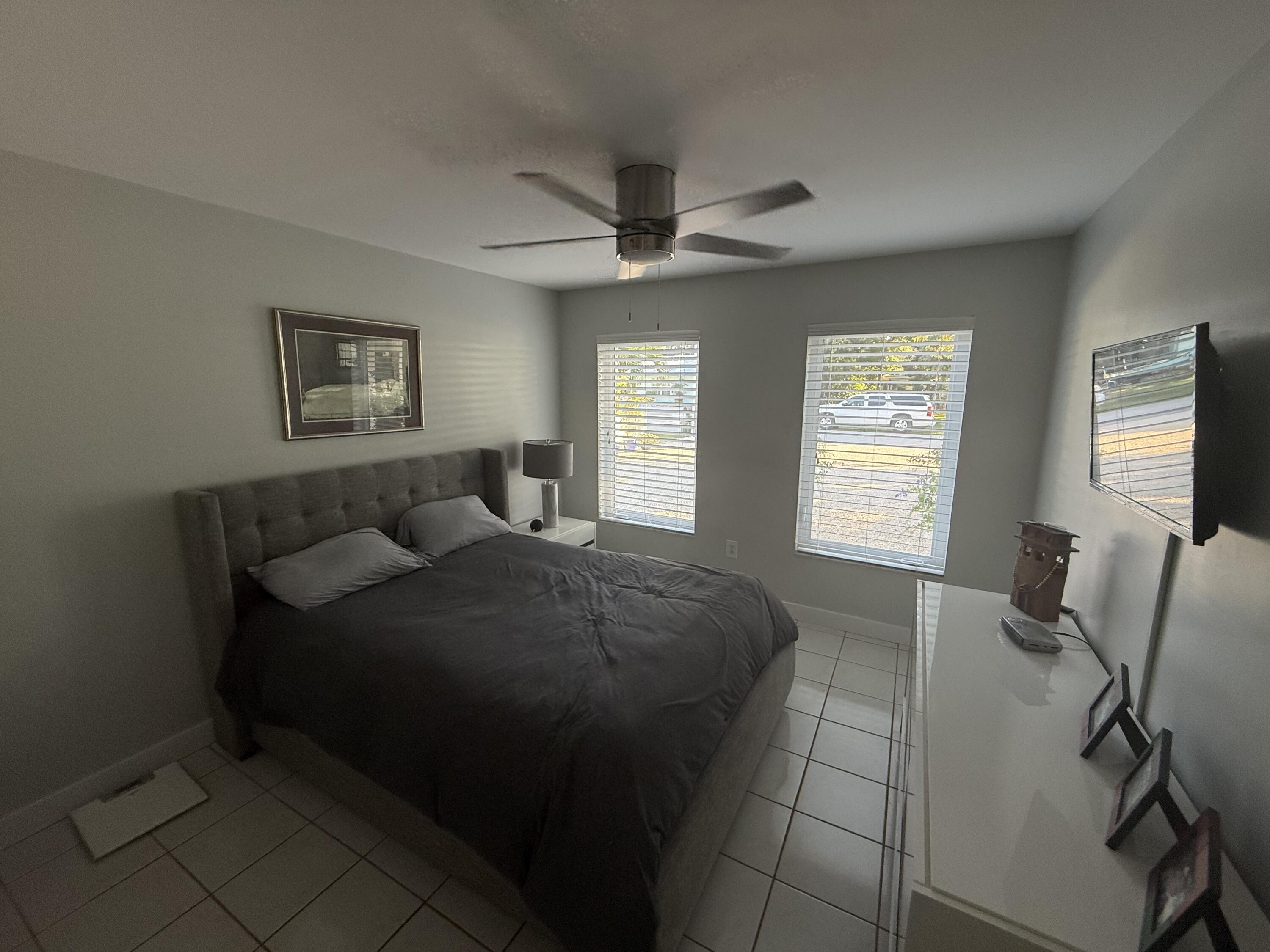 8 North End Road Key Largo, FL 33037 - Photo 9 of 16 a living room with a bed furniture and a window