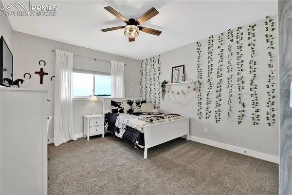 a spacious bedroom with a bed and a window