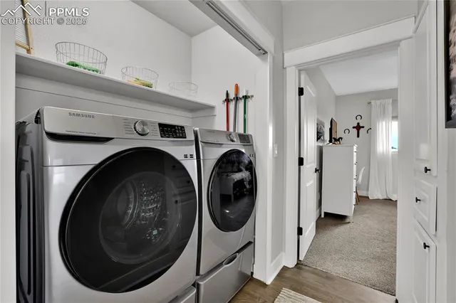 a view of a hallway with washer and dryer