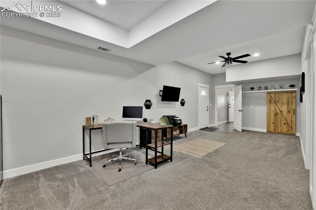18135 Spur Ranch Road Peyton, CO 80831 - Photo 28 of 36 a view of workspace with livingroom