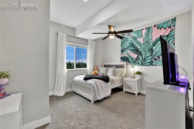 a bed room with bed and a window