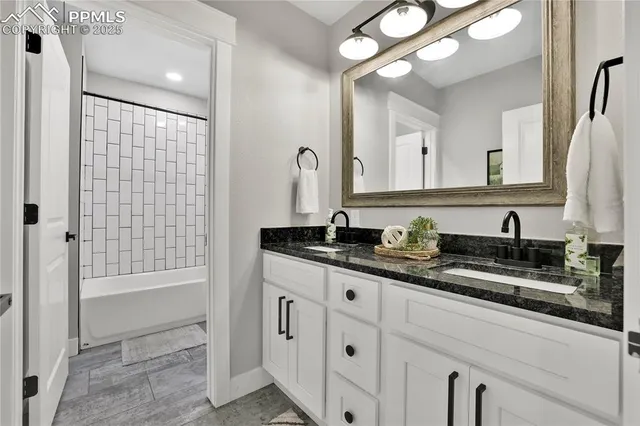 a bathroom with a sink double vanity and a mirror