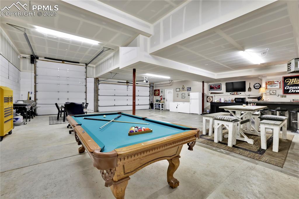 18135 Spur Ranch Road Peyton, CO 80831 - Photo 33 of 36 a room with furniture pool table and chairs