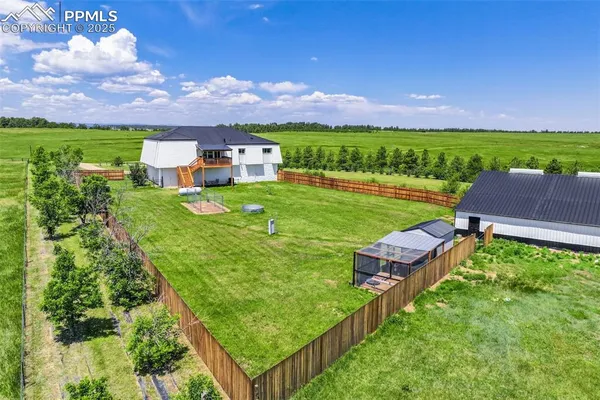 a view of a garden with houses