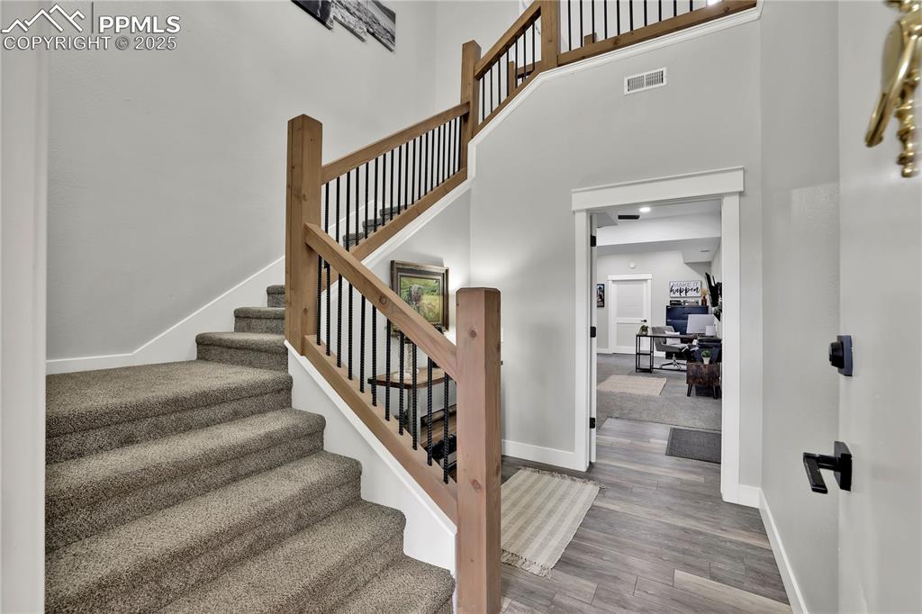 18135 Spur Ranch Road Peyton, CO 80831 - Photo 4 of 36 a view of entryway and hall with wooden floor