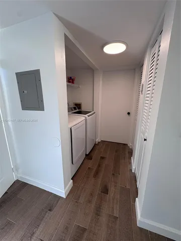 a view of a kitchen from the hallway