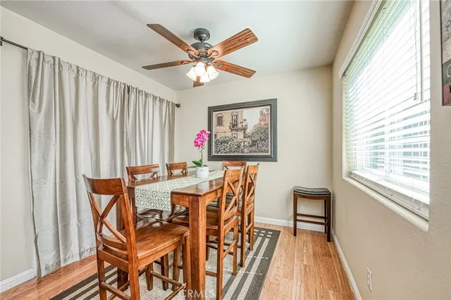 a view of a dining room with furniture and a window
