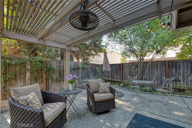 a patio with patio a couch and chairs