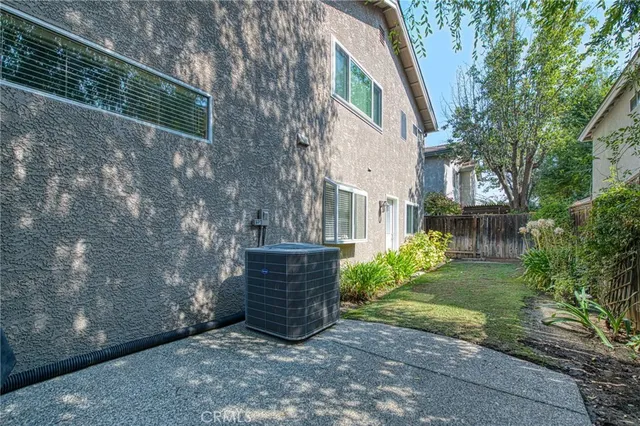 a view of backyard with plants and trees